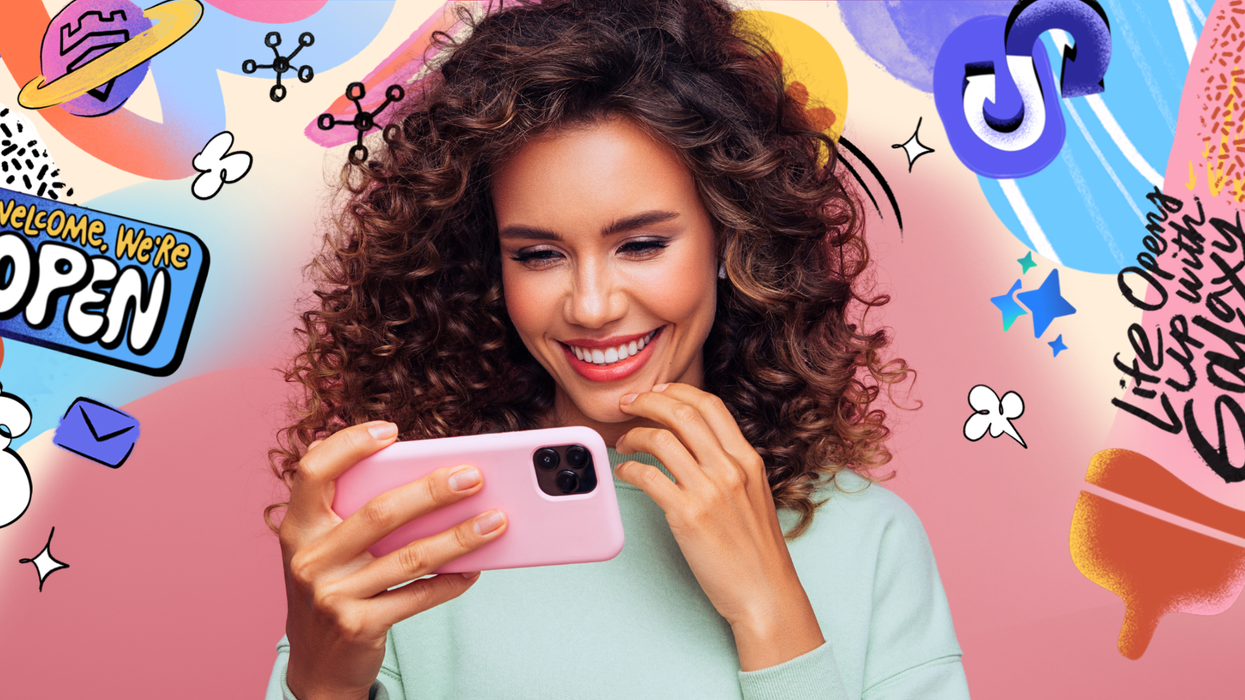 a woman smiles looking at an iPhone with colourful graphics from Samsung behind her advertising its Try Galaxy service