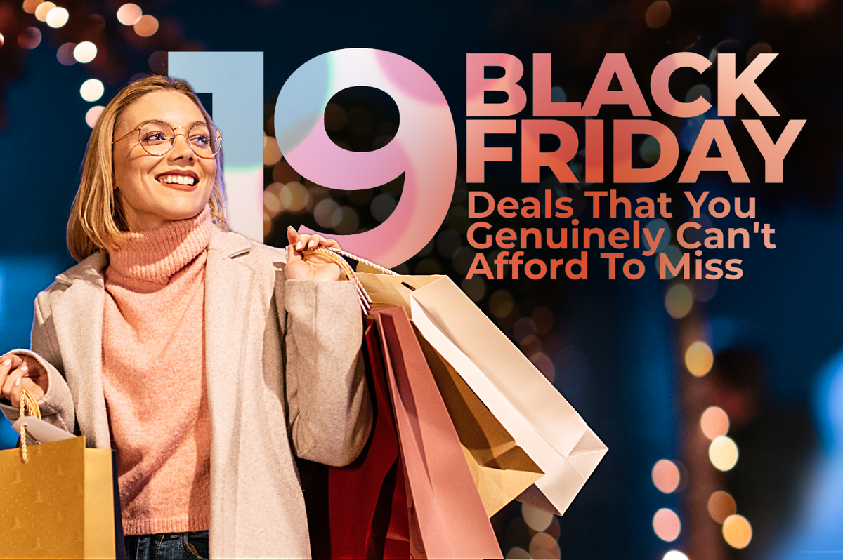 a woman smiles with shopping bags in her hands with bright christmas lights behind her