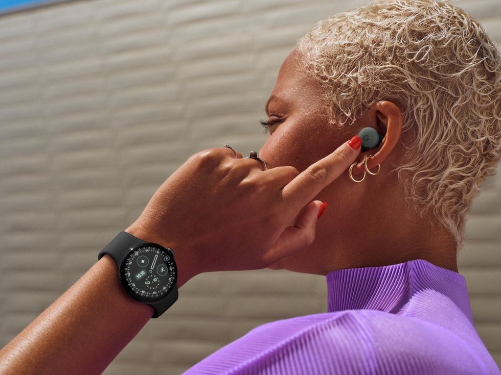 a woman taps the pixel buds 2a in her ears