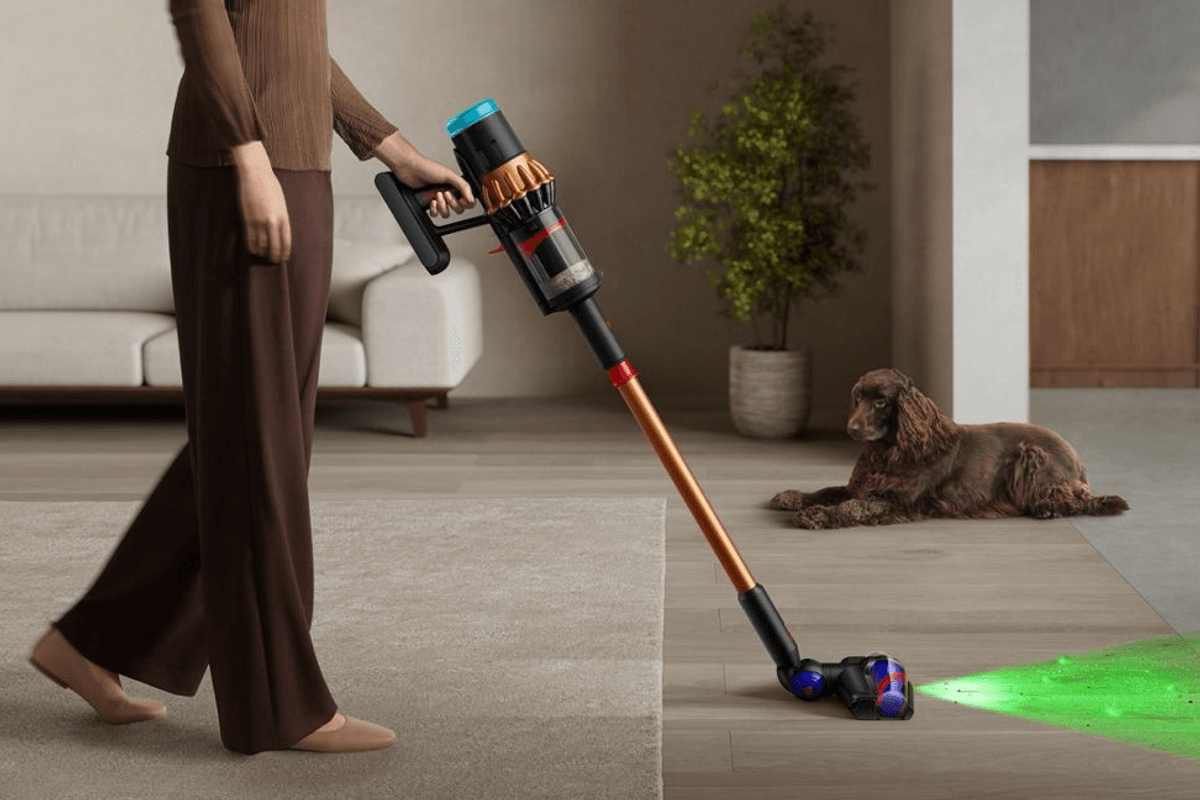 a woman walks from carpet to hard flooring with the V16 Piston Animal