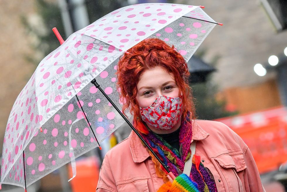 A woman wearing a face mask in the centre of Cardiff.