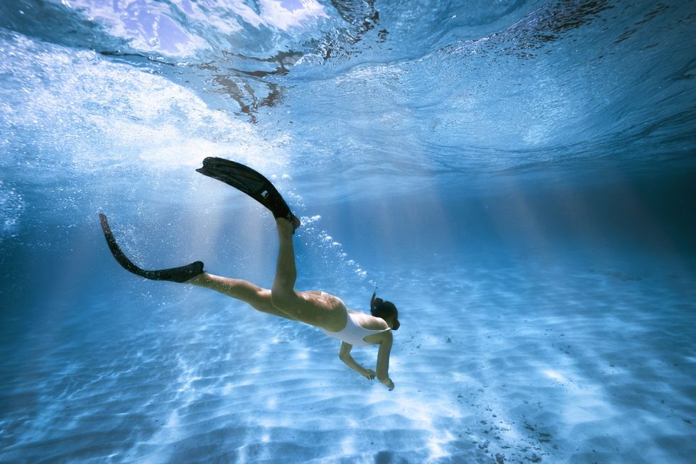 A women diving in the ocean