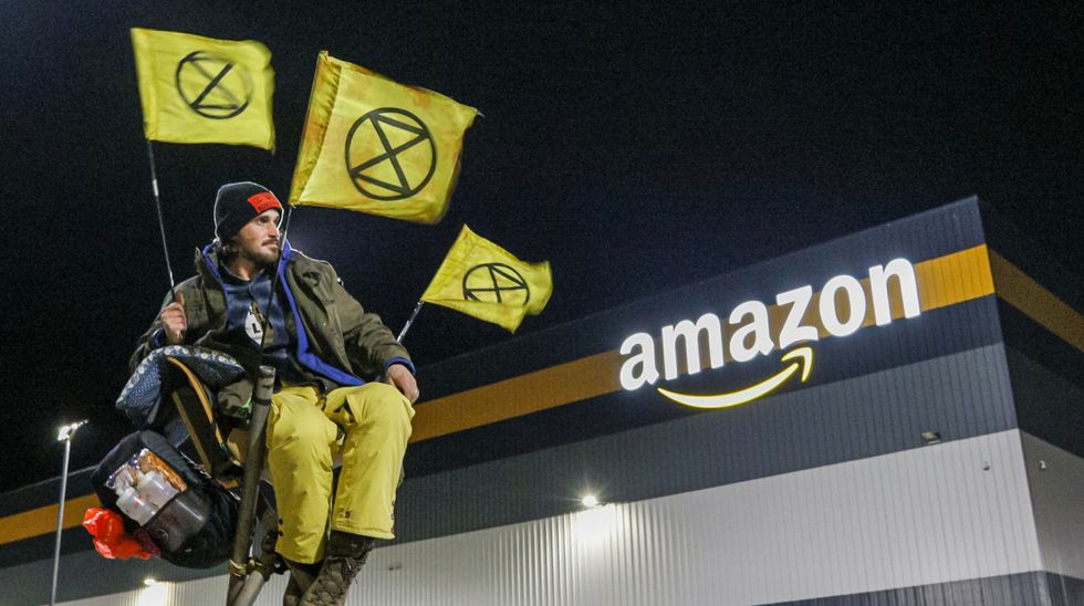 A XR activist blocking an Amazon warehouse