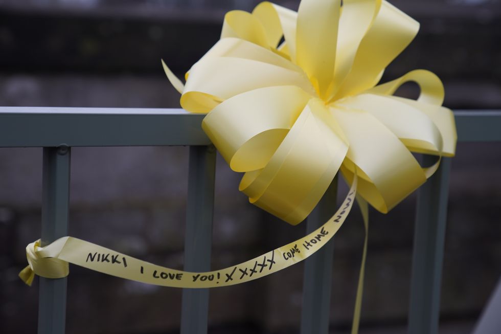 A yellow ribbon with a message of hope written on it, is tied to a bridge over the River Wyre in St Michael's on Wyre, Lancashire, as police continue their search for missing woman Nicola Bulley, 45, who was last seen on the morning of Friday January 27, when she was spotted walking her dog on a footpath by the nearby River Wyre. Picture date: Sunday February 12, 2023.