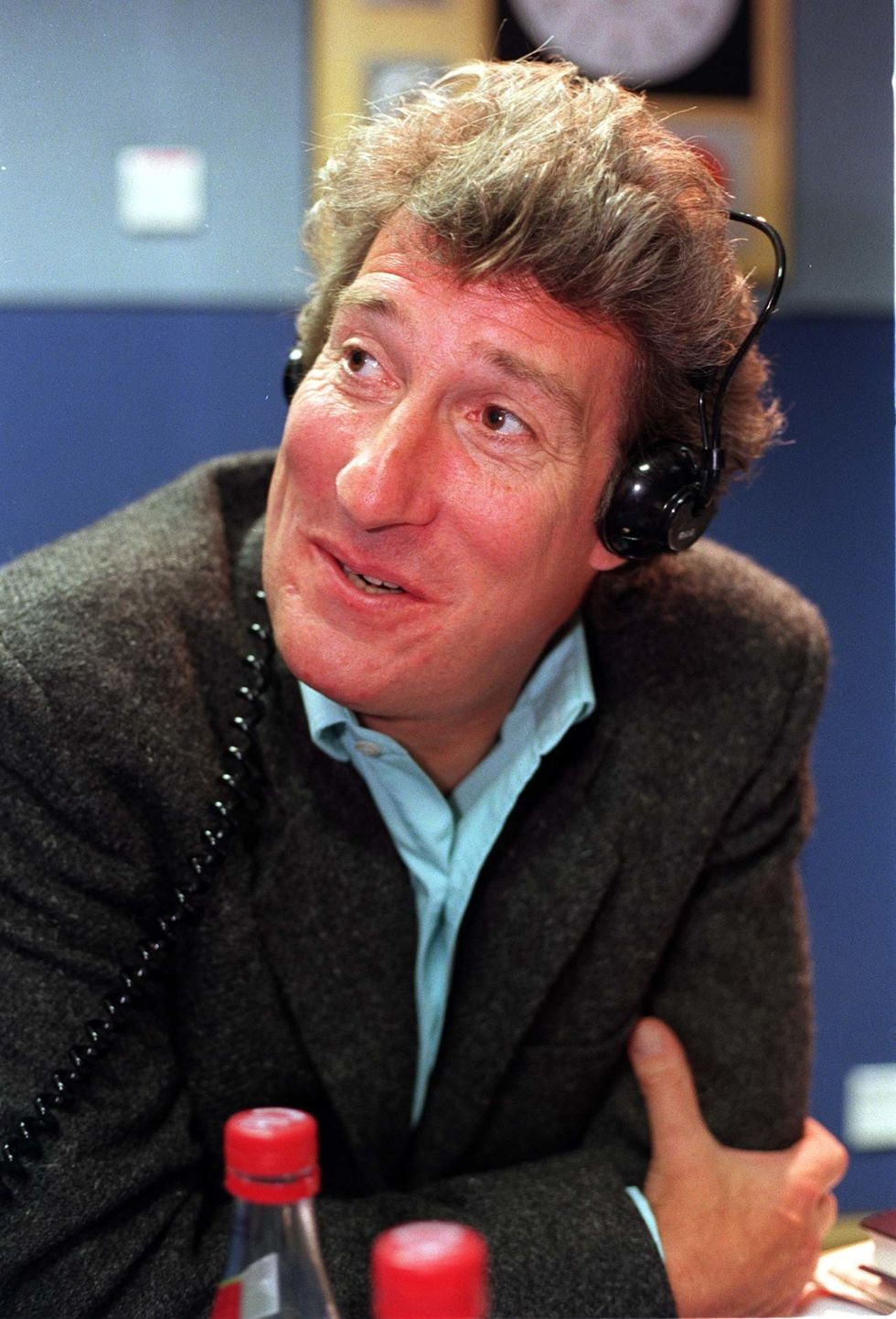 A younger Jeremy Paxman with headphones on