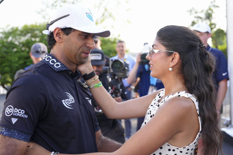 Aaron Rai embraces his wife following his PGA Championship win