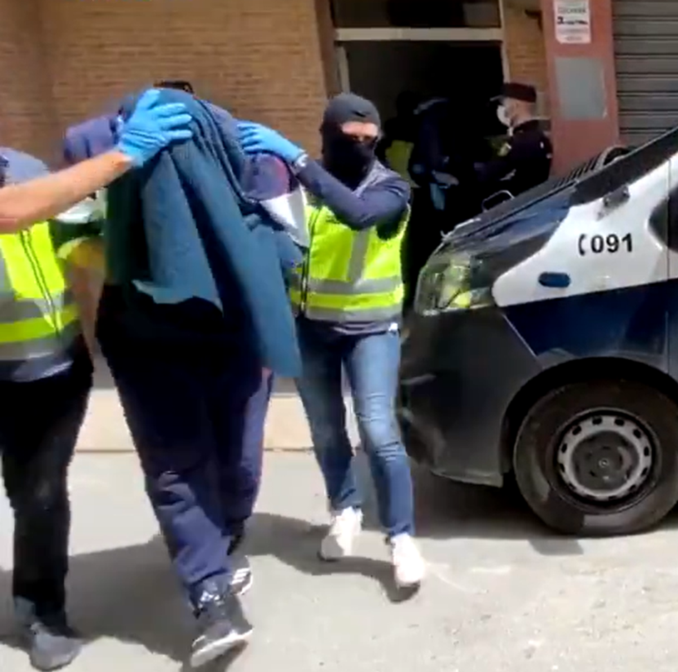 Abdel-Majed Abdel Bary being led away