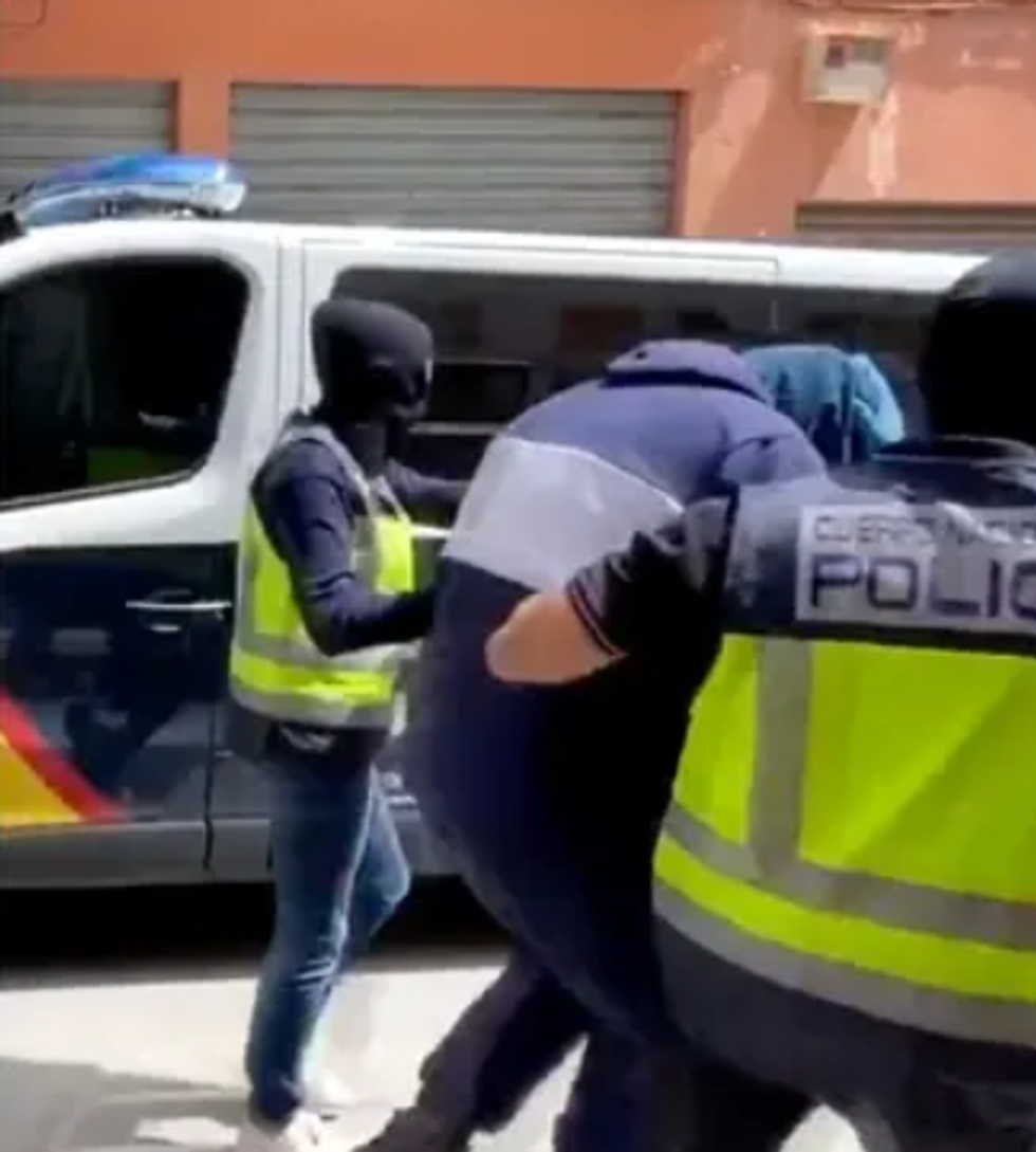 Abdel-Majed Abdel Bary being led away