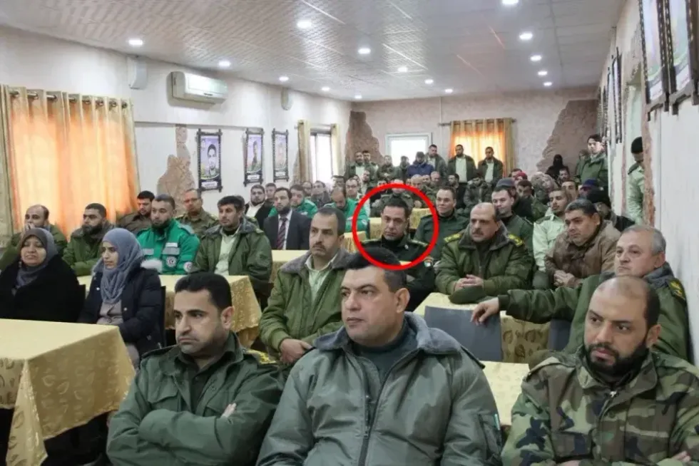 Abu Safiya is circled in a picture of a group of people, majority of them wearing some sort of military uniform