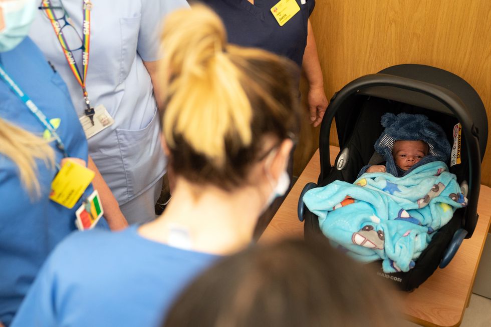 Accident and emergency nurses with two-week-old baby Mohammed Ibrahim at Northwick Park Hospital in Harrow. Mohammed's mother Lalene Malik, 23, went to A&E with stomach cramps on March 26 and gave birth to her baby in the toilets, having not known she was pregant and with no outward physical signs of pregnancy. Picture date: Wednesday April 13, 2022.