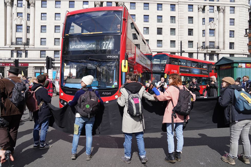 Activists from Extinction Rebellion demonstrate near Marble Arch in central London. Picture date: Saturday April 9, 2022.