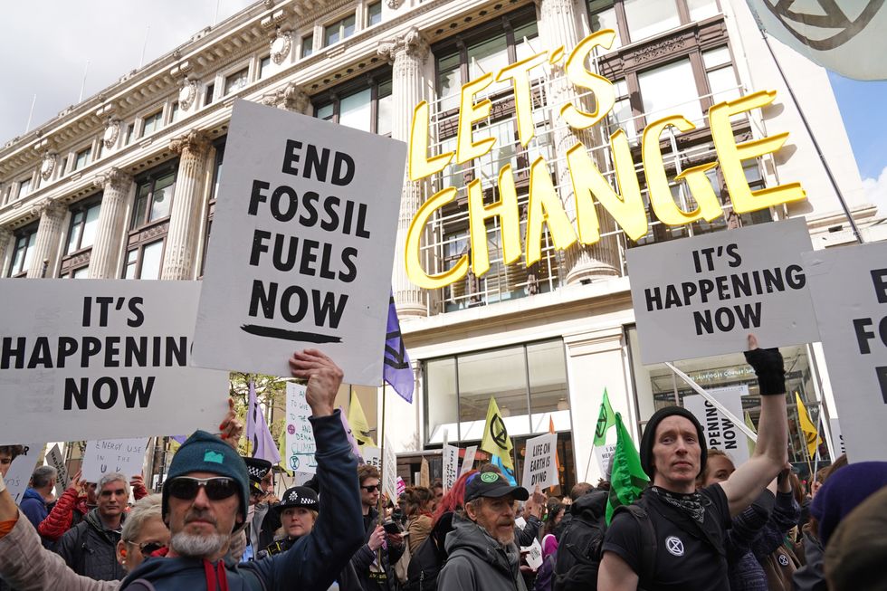 Activists from Extinction Rebellion demonstrate on Oxford Street in central London. Picture date: Saturday April 9, 2022.