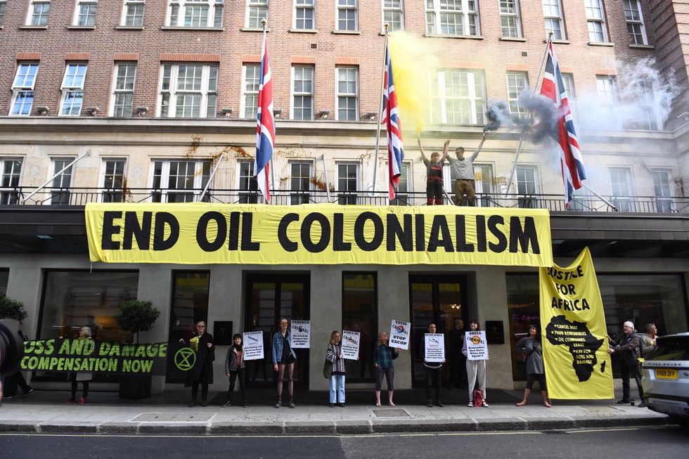 Activists outside the May Fair Hotel
