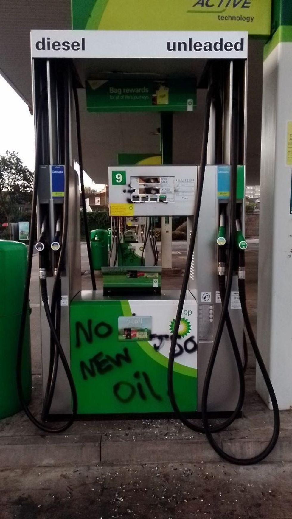 Activists rendered fuel pumps unusable by breaking their display glass or covering them with spray paint