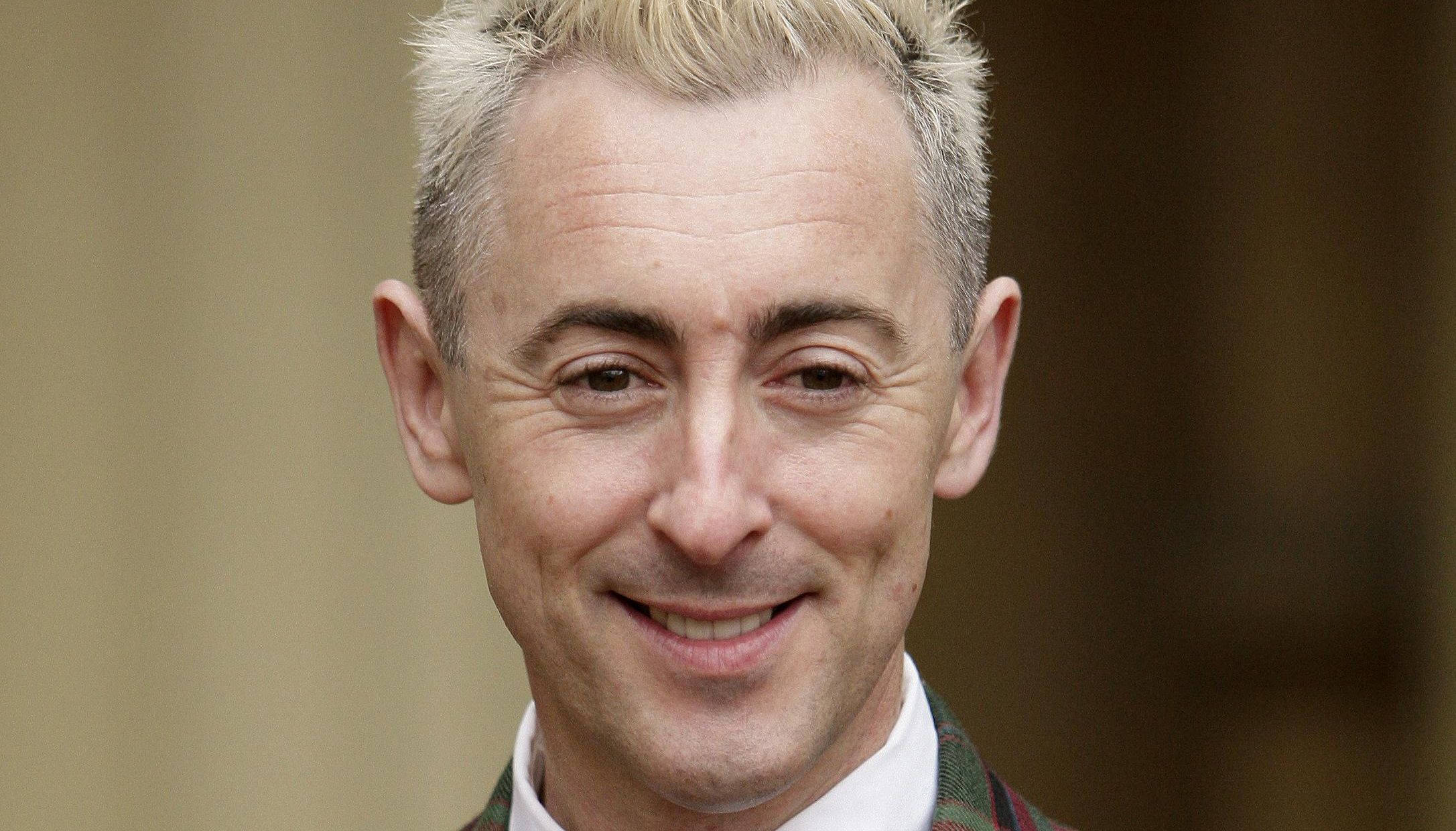 Actor Alan Cumming wears his OBE, which was awarded to him by the the Princess Royal, during an investiture ceremony at Buckingham Palace, London.