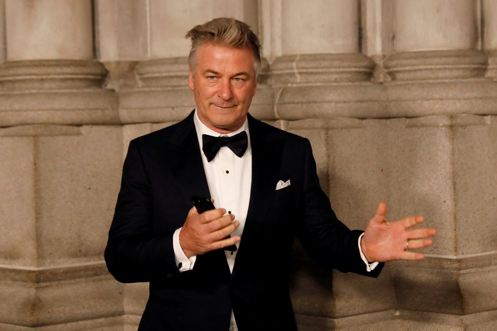 Actor Alec Baldwin gestures before walking on the red carpet during the commemoration of the Elton John AIDS Foundation 25th year fall gala at the Cathedral of St. John the Divine in New York City, in New York, U.S.