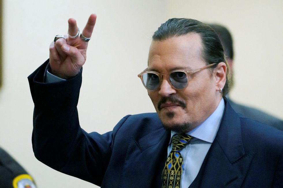 Actor Johnny Depp gestures during his defamation case against ex-wife, actor Amber Heard, in the courtroom at the Fairfax County Circuit Courthouse in Fairfax, Virginia, U.S., May 23, 2022. Steve Helber/Pool via REUTERS