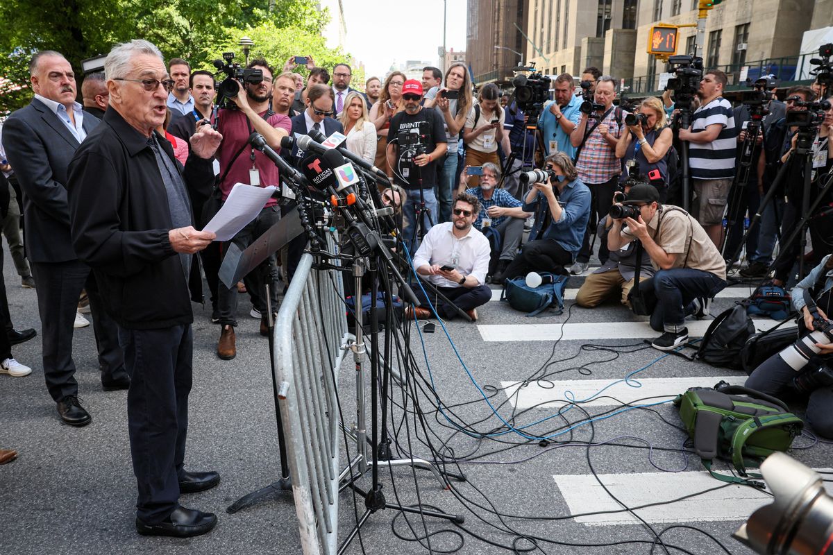 Actor Robert De Niro speaks during a news conference outside the court where former US President Donald Trump