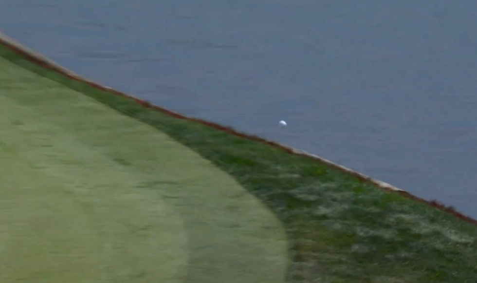 Adam Hadwin's approach shot bounced into the water
