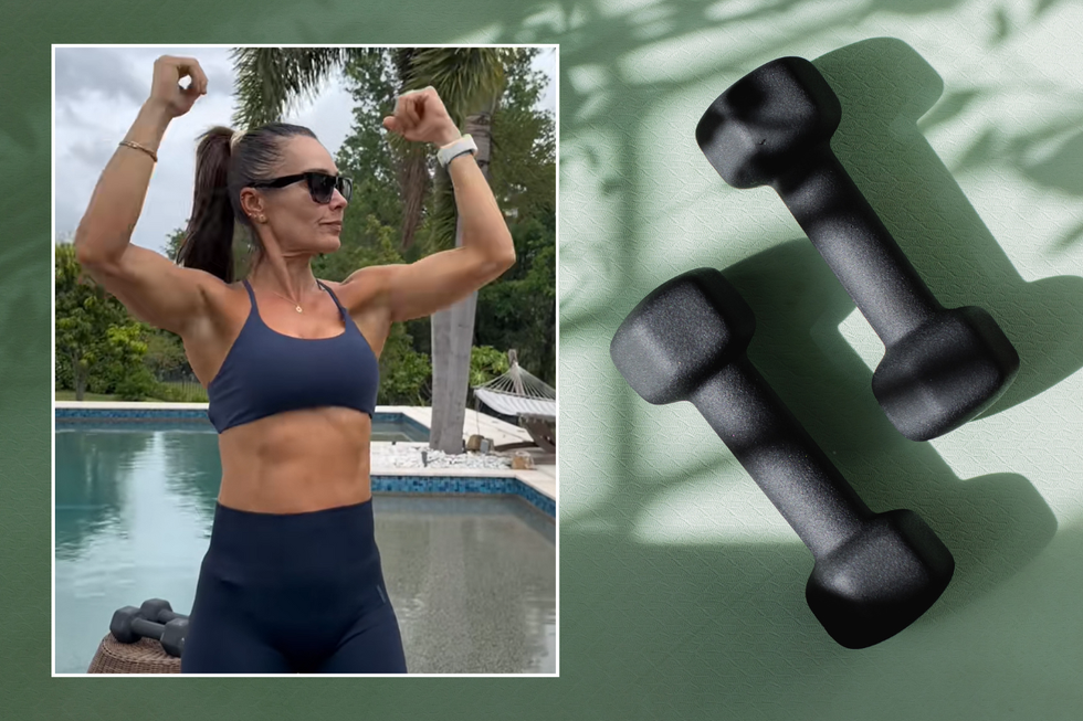 Addy showing off her arms; black dumbbells on a green yoga mat