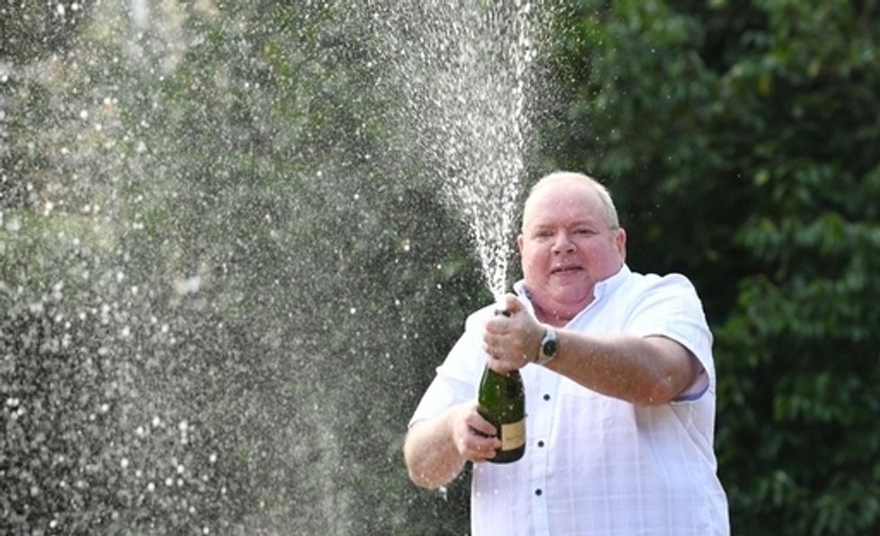 Ade Goodchild celebrates after winning the life-changing EuroMillions in 2019.