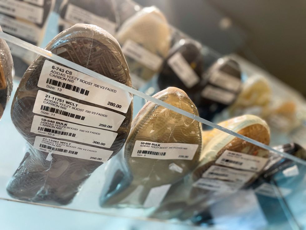 Adidas Yeezy shoes are seen in a store on the day Adidas terminated its partnership with the American rapper and designer Kanye West, now known as Ye, in Garden City, New York, U.S., October 25, 2022. REUTERS/Shannon Stapleton