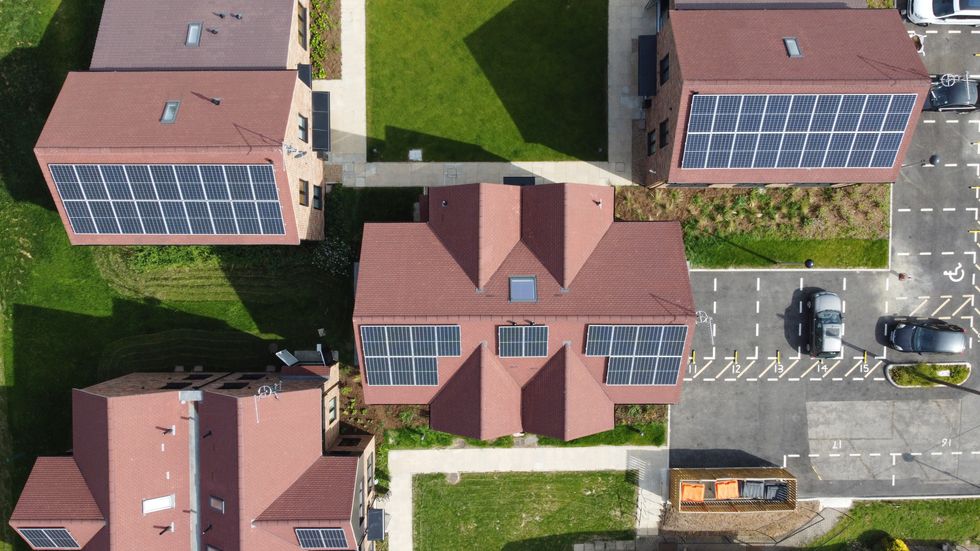 Aerial view of new houses with solar panels installed on the roofs