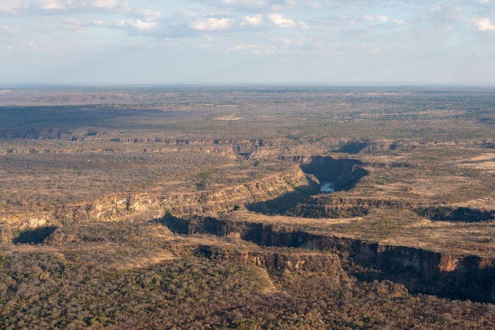 Aerial View Of Victoria Falls On The Zambezi River On The Border Of Zimbabwe And Zambia, viewed from helicopter
