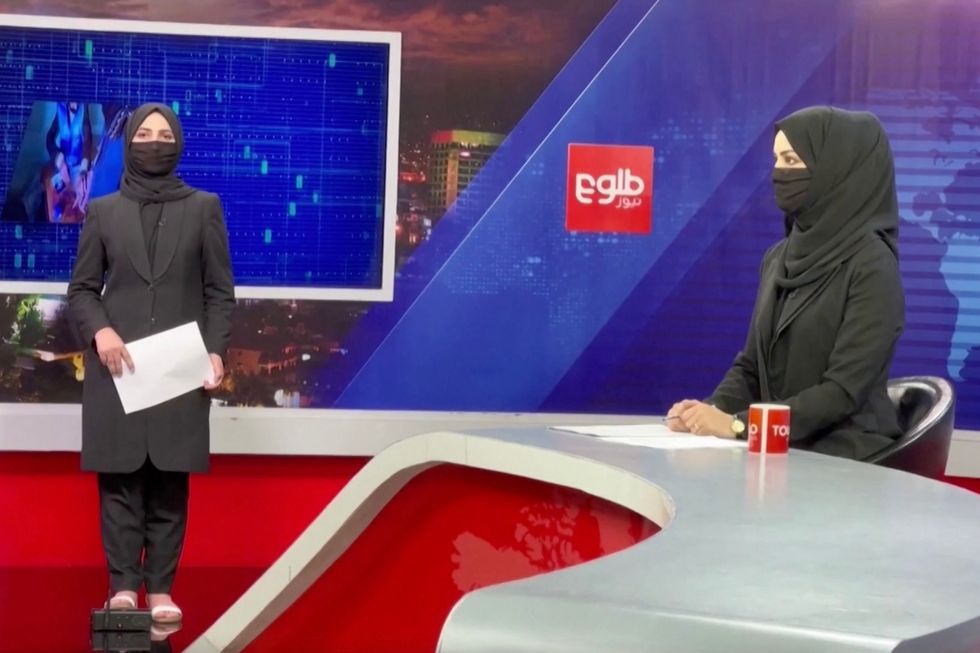 Afghan anchors wearing face coverings