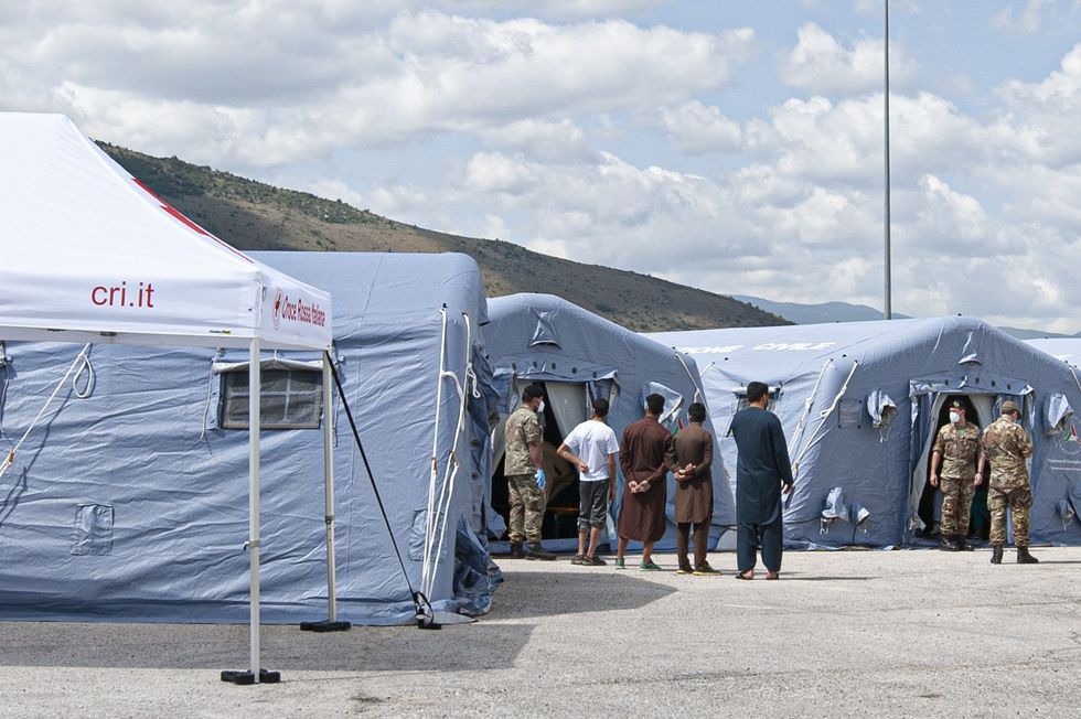 Afghan refugees at a crisis centre in L'Aquila in 2021