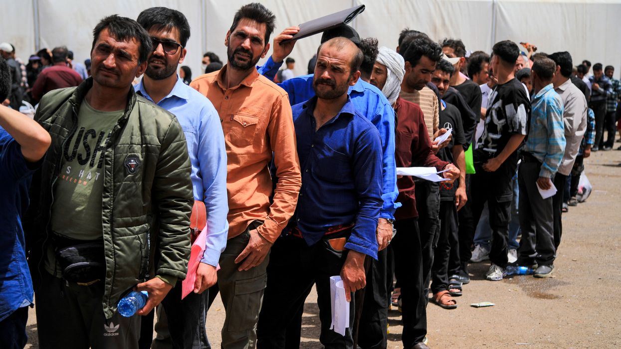 Afghans queue up by the border as Iran cracks down on migrants