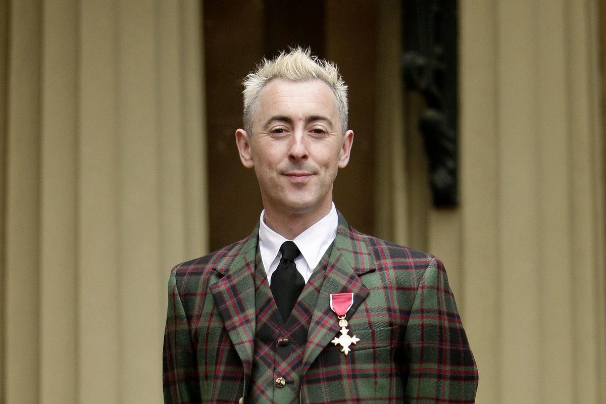 Alan Cumming has handed back his OBE