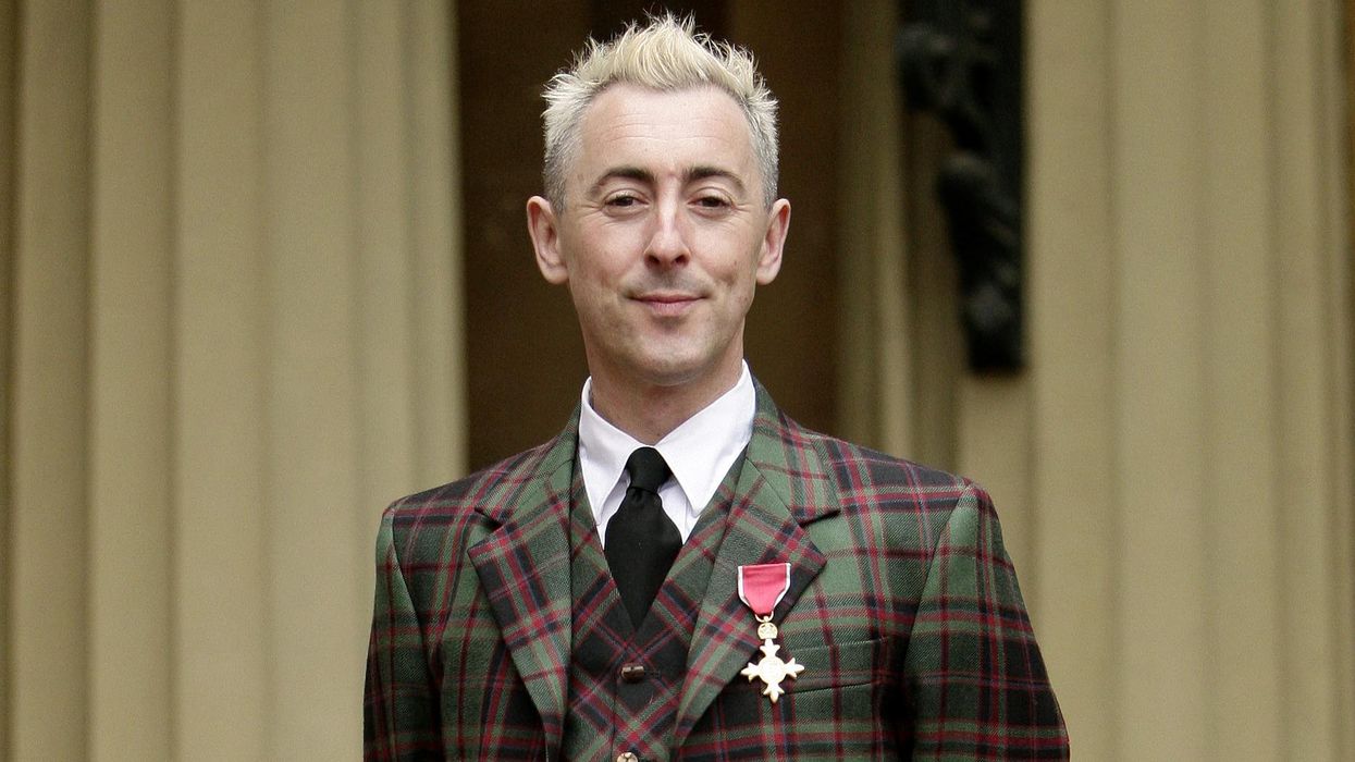 Alan Cumming has handed back his OBE