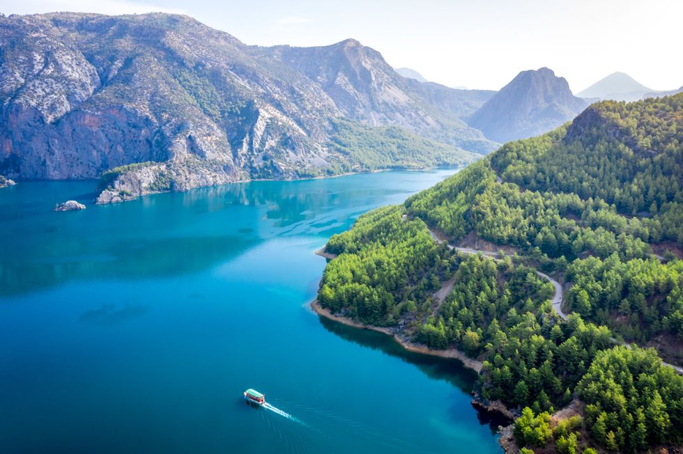 Alanya Taurus Mountains and turquoise water of the lake. Manavgat, Turkey, Antalya