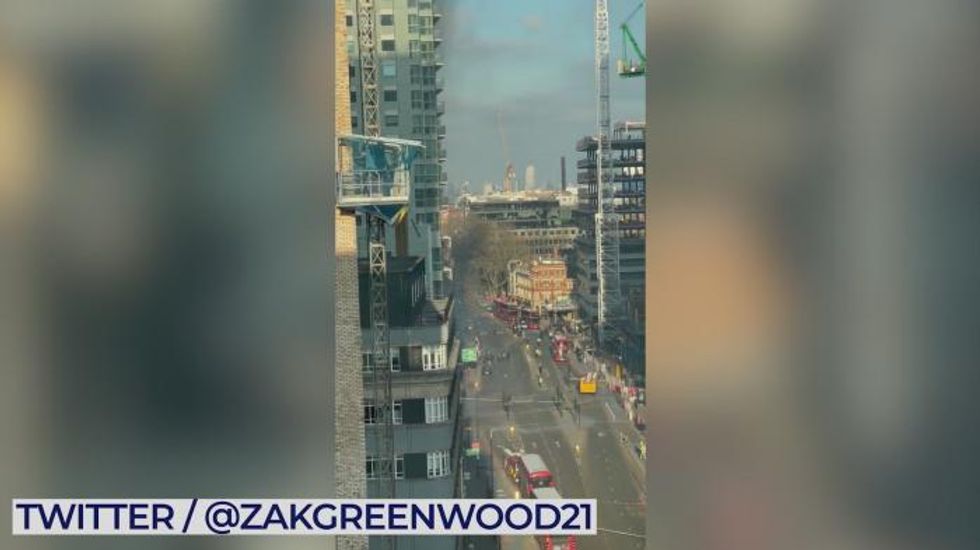 Huge fire breaks out in London high-rise building as 100 firefighters flock to tackle blaze - WATCH