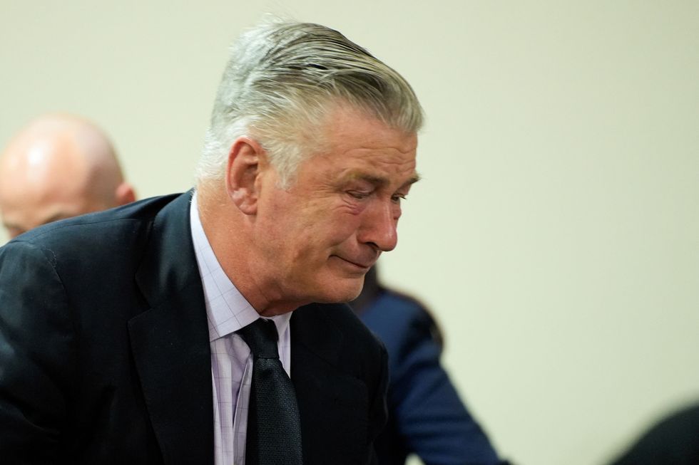 Alec Baldwin breaks down as judge dismisses involuntary manslaughter charges