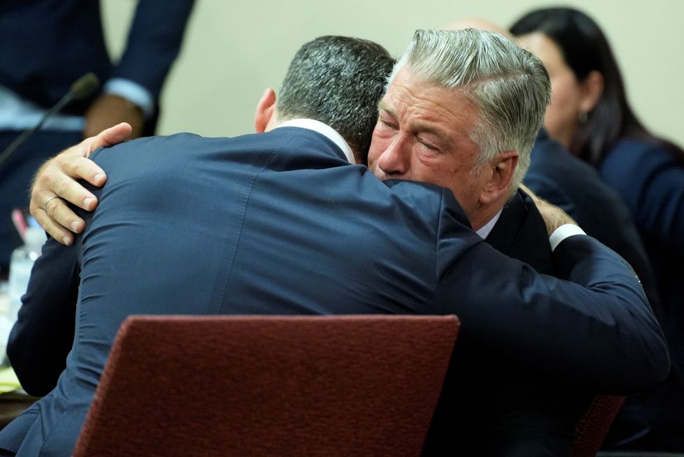 Alec Baldwin hugs his attorney Alex Spiro at the conclusion of Baldwin's trial