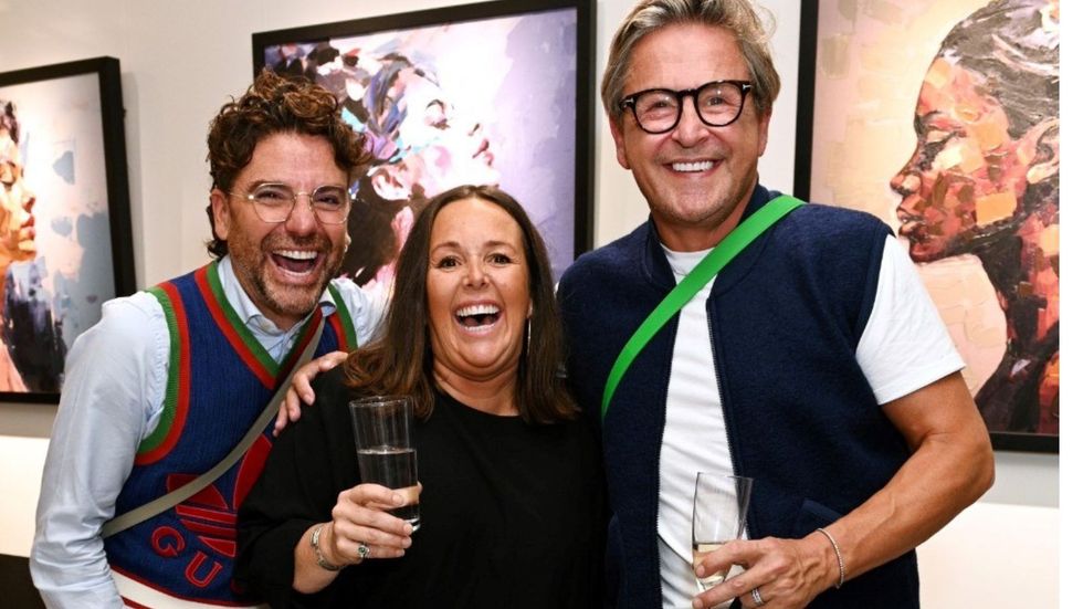 Alex Johnson with friends at her exhibit