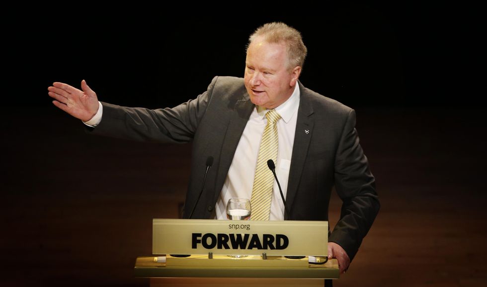 Alex Neil MSP, Cabinet Secretary for Health and Well-being, addresses the Scottish National Party (SNP) annual national conference at Perth Concert Hall in Scotland.