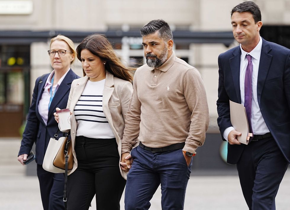 Alice da Silva Aguiar's parents Sergio and Alex (centre) arrive at Liverpool Town Hall for the Southport Inquiry\u200b