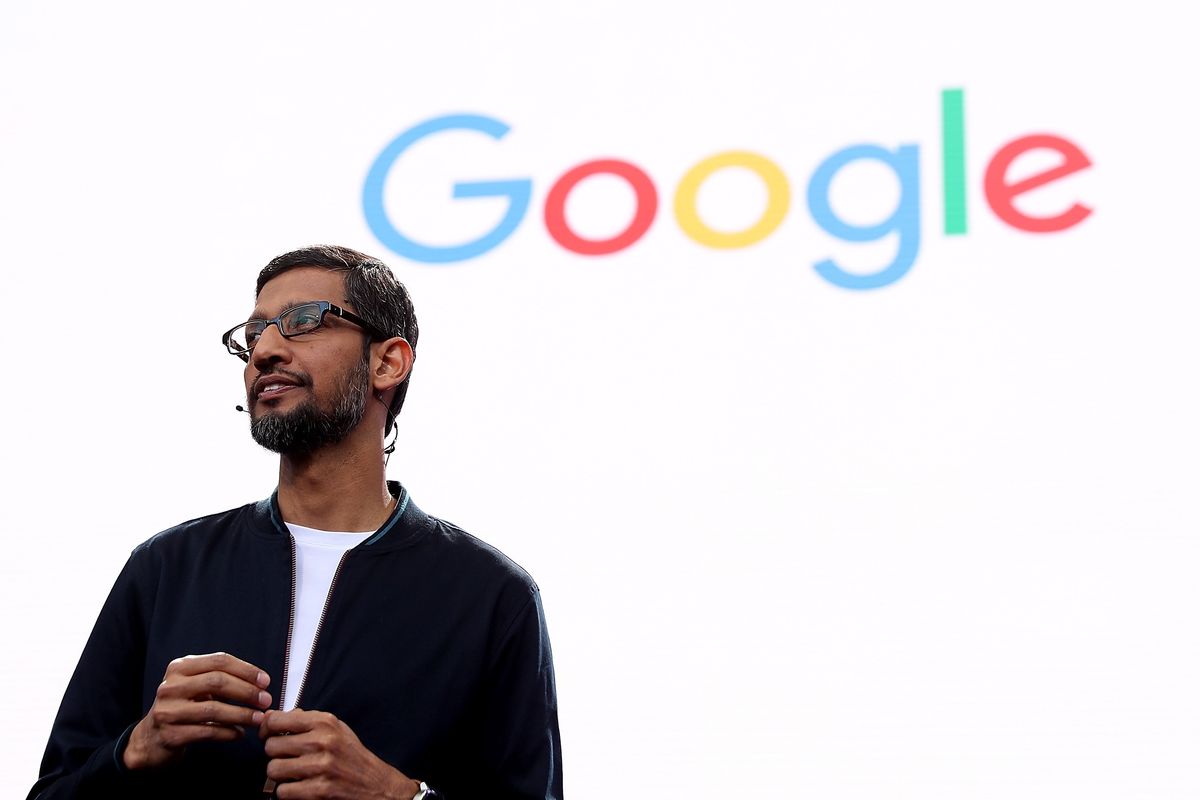 alphabet inc boss sundar pichai speaking during google io developer conference in front of the google logo 