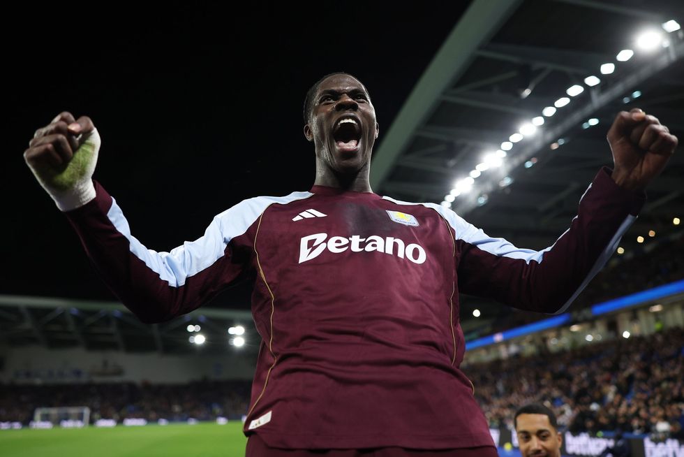 Amadou Onana of Aston Villa celebrates towards the fans after Donyell Malen (not pictured) scores his team's fourth goal
