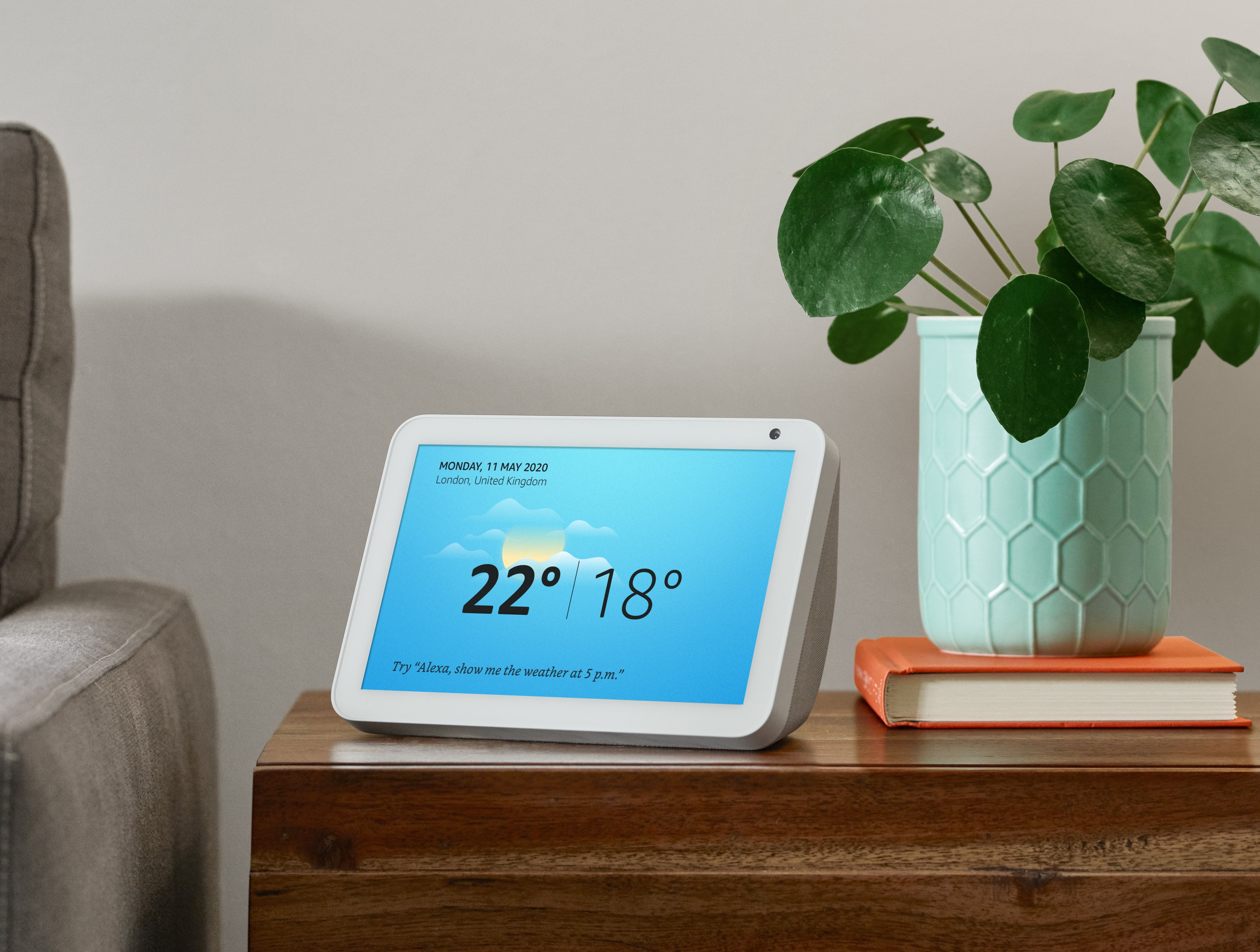amazon echo smart display on the sideboard with the weather on screen