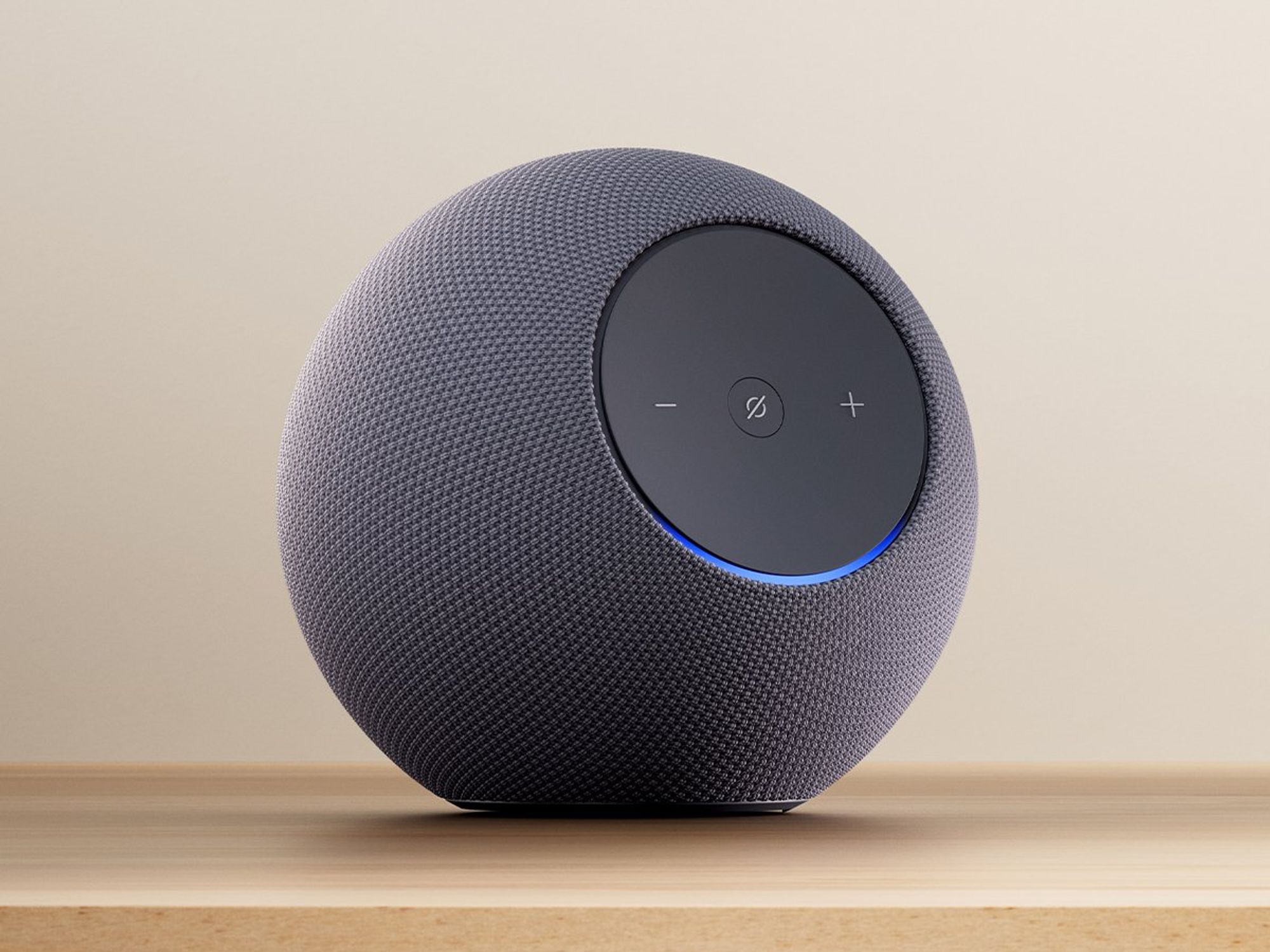 amazon echo studio pictured on a wooden side table