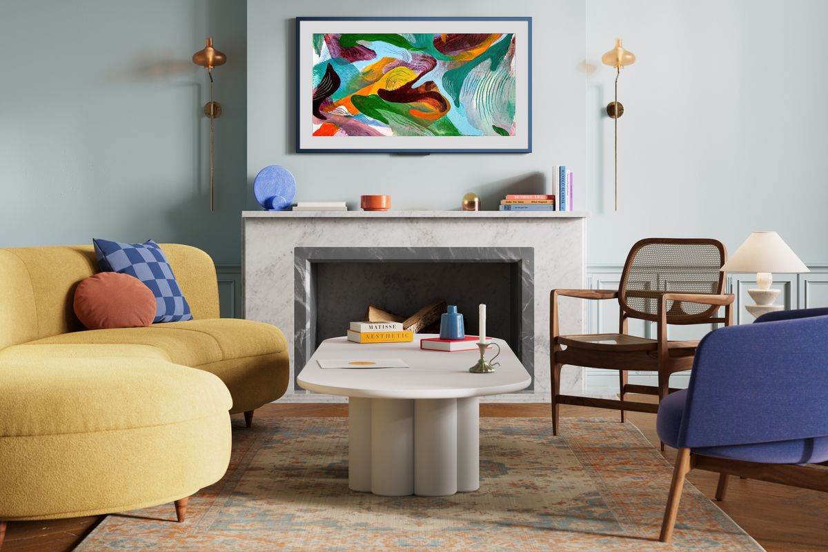 Amazon Ember Artline pictured on the wall with colourful artwork shown on-screen