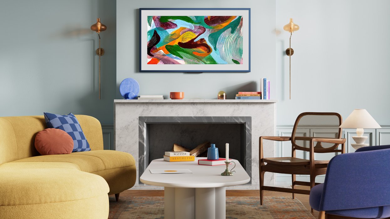 Amazon Ember Artline pictured on the wall with colourful artwork shown on-screen
