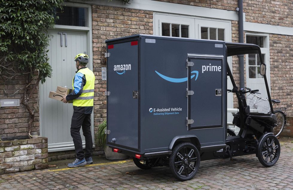 Amazon Prime e-assisted vehicle and person delivering parcels