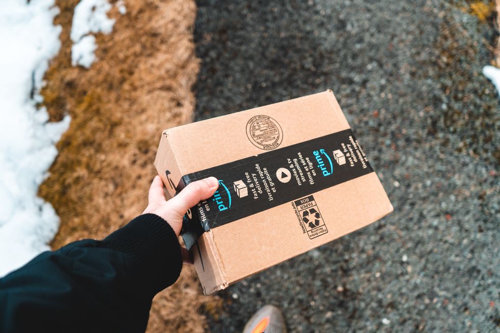 Amazon Prime package carried by delivery man