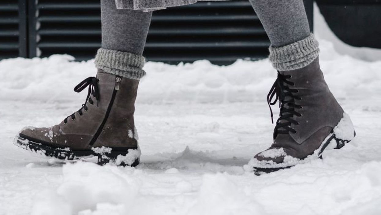 Amazon Sorel Women's Snow Angel Winter Boots / UGG Classic Mini II Boot / Moon Boot EVX Light Low Black Nylon Boots / Woman walking in snow wearing winter boots