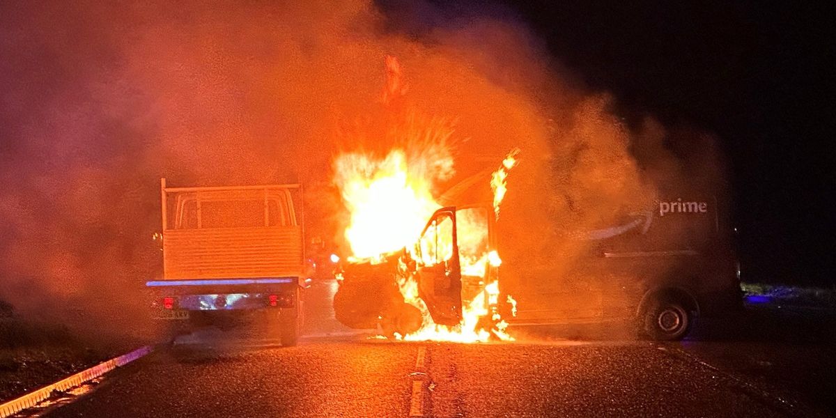 NextImg:Amazon delivery van erupts into flames after colliding with bus full of children